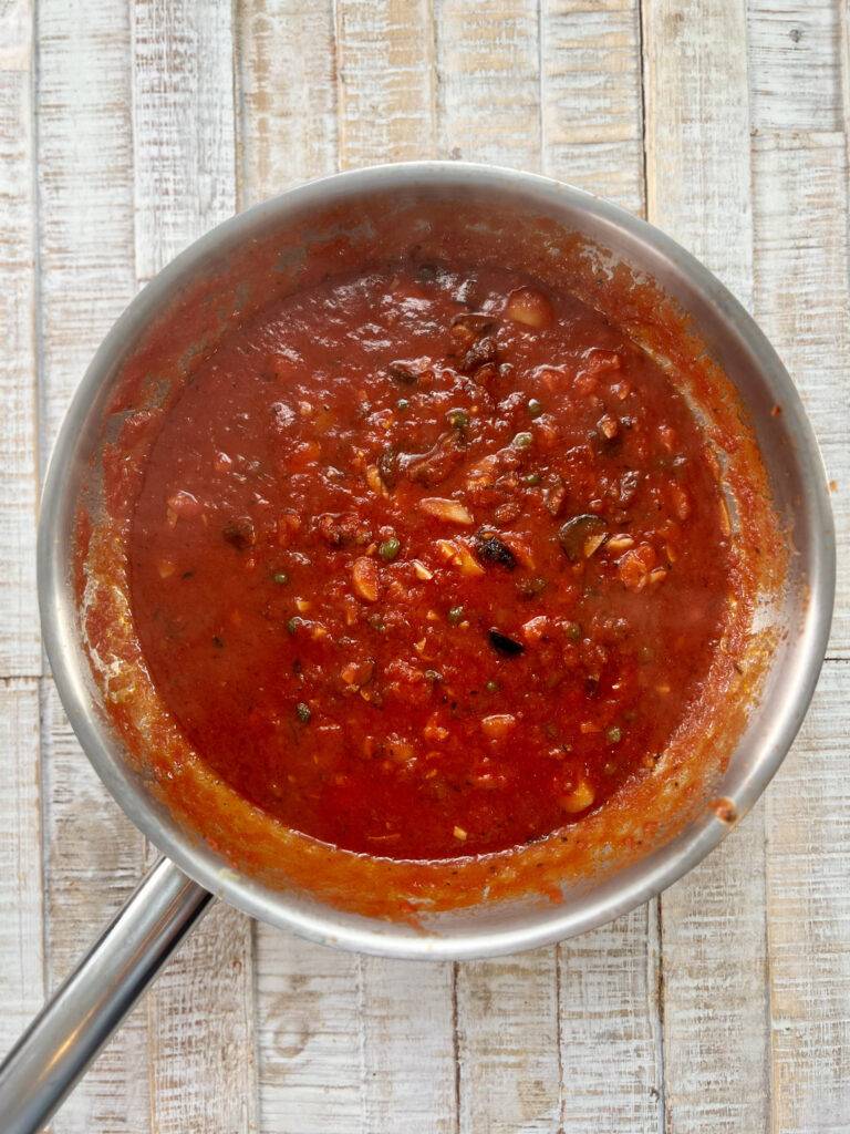 Reduced sauce for puttanesca in pan