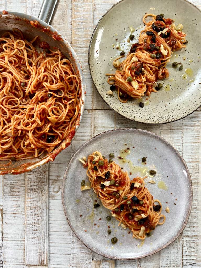 Plated Spaghetti alla puttanesca, garnished