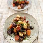 Oven roasted vegetables on two plates
