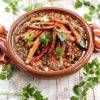 Vegan Tagine garnished with parsley hot and steaming