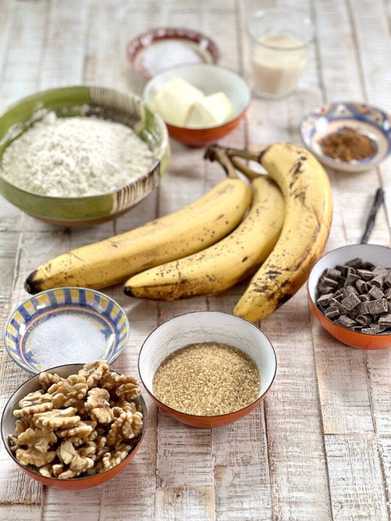Ingredients for banana bread in little ceramic bowls