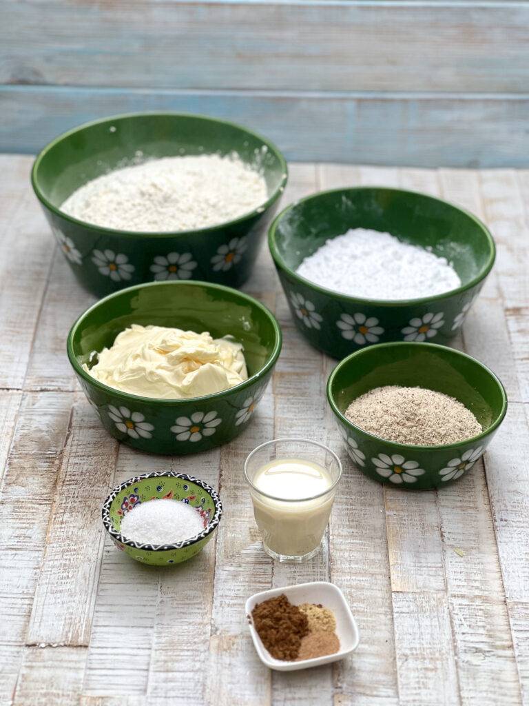 Ingredients for vegan shortbread cookies in green ceramic bowls
