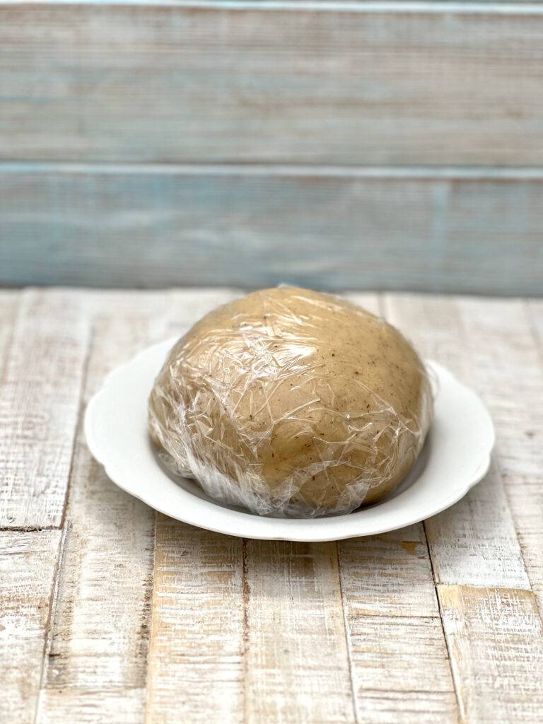 Ball of shortbread dough wrapped 