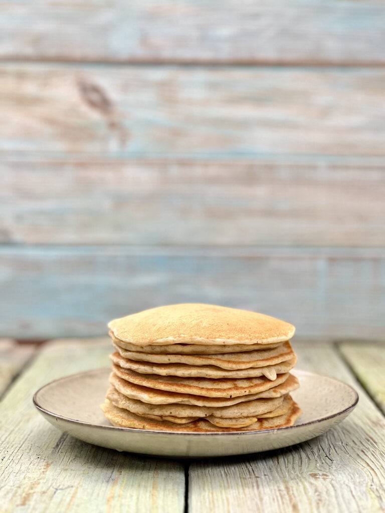 Staple of pancakes on a grey plate