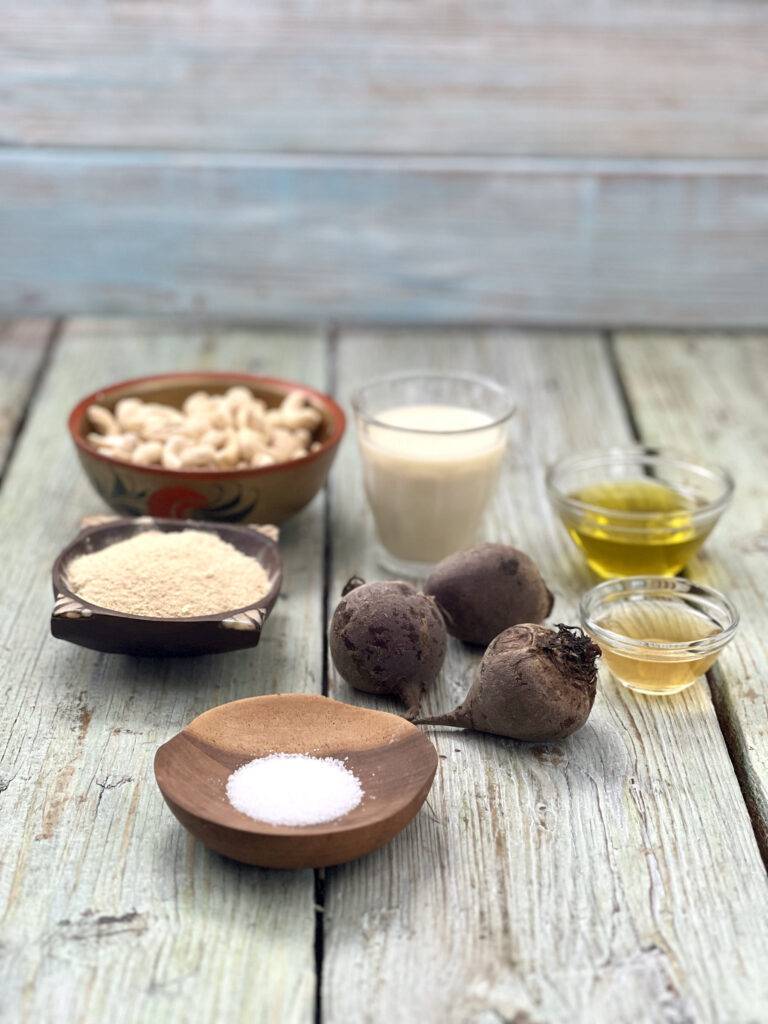 Ingredients for vegan beet cream cheese in wooden bowls