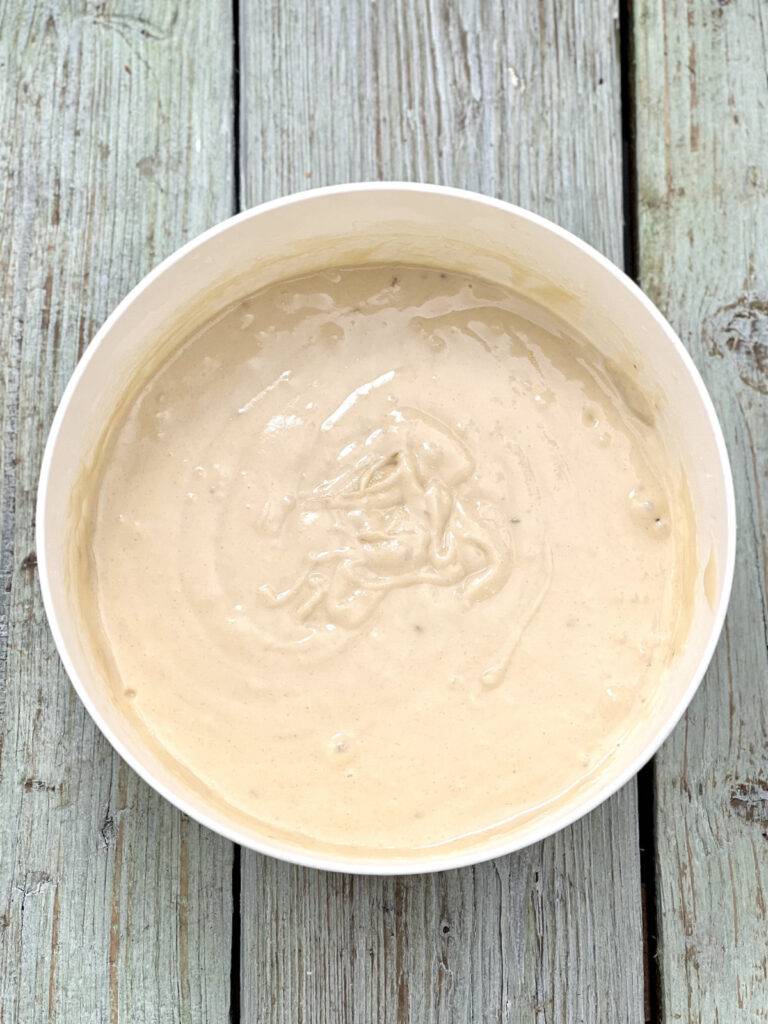 Combined cake batter in a white bowl 