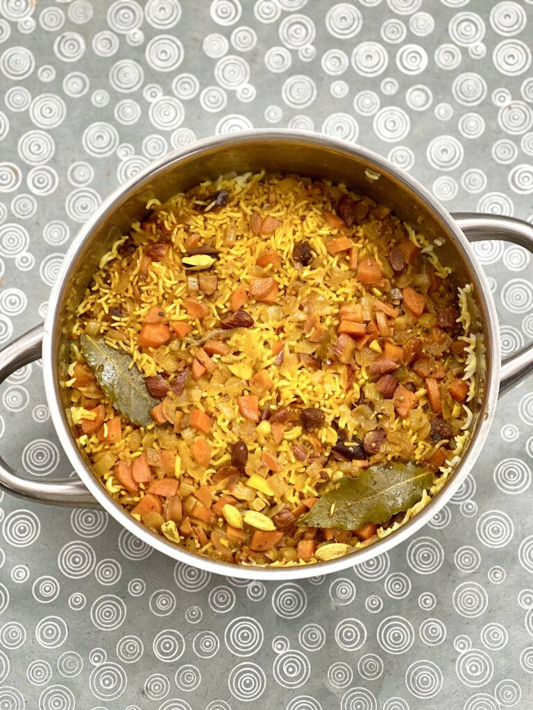 Finished vegan pilaf rice in a stainless steel pot