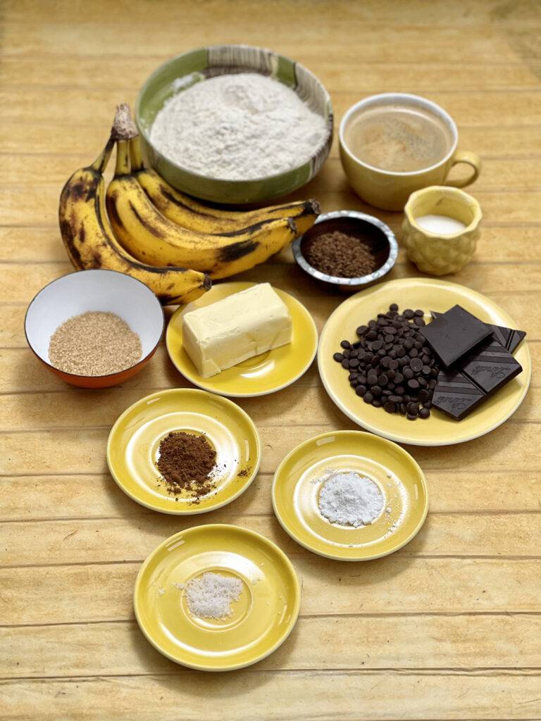 Ingredients for vegan coffee banana bread on yellow little plates