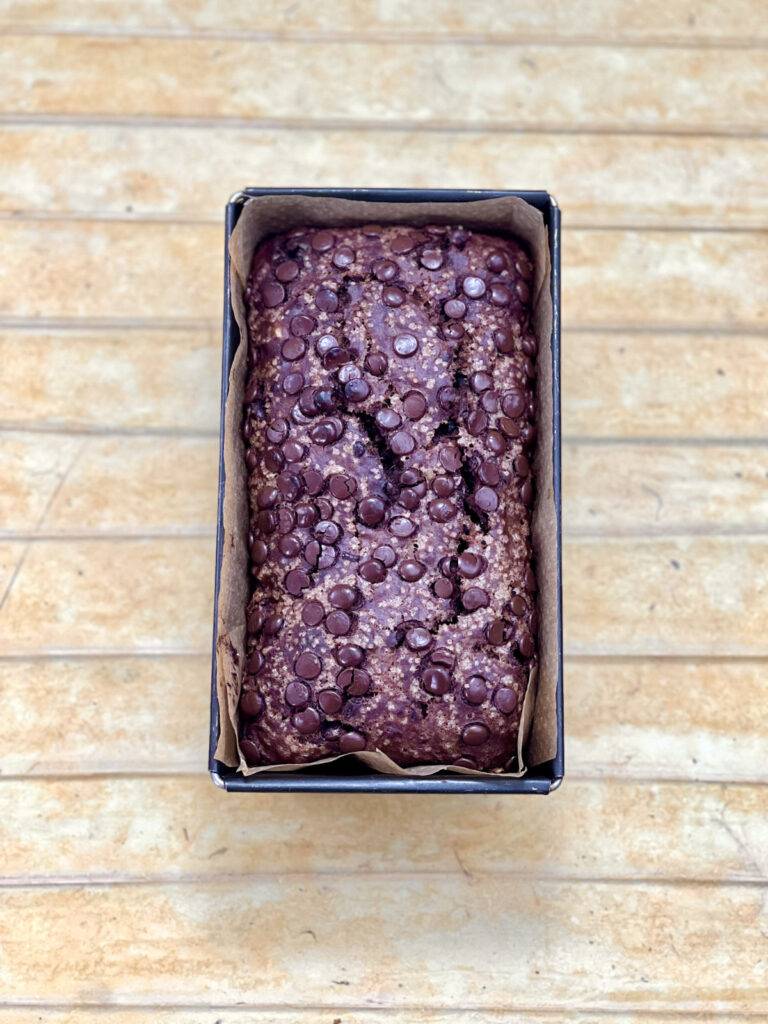 A load of baked coffee banana bread in a baking tin