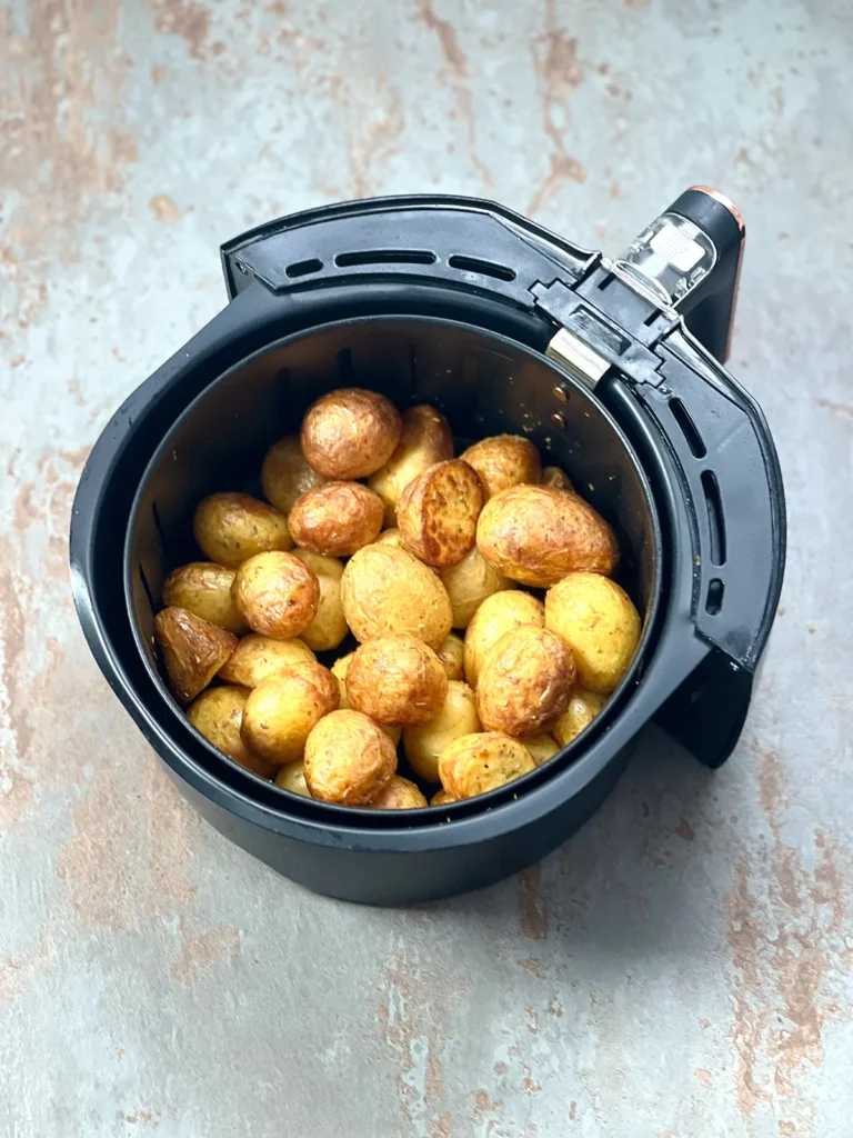 Roasted young potatoes in the air fryer basket