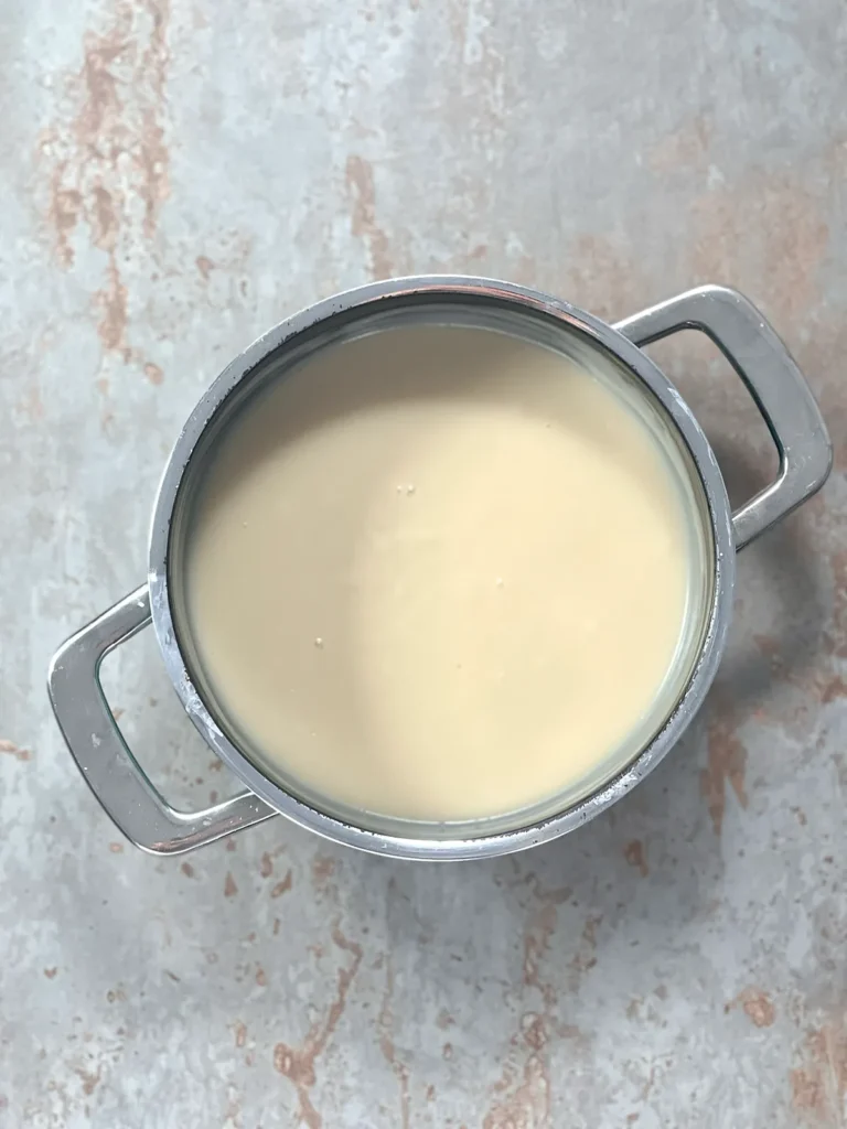 The thickened custard in a pot on a stone underground