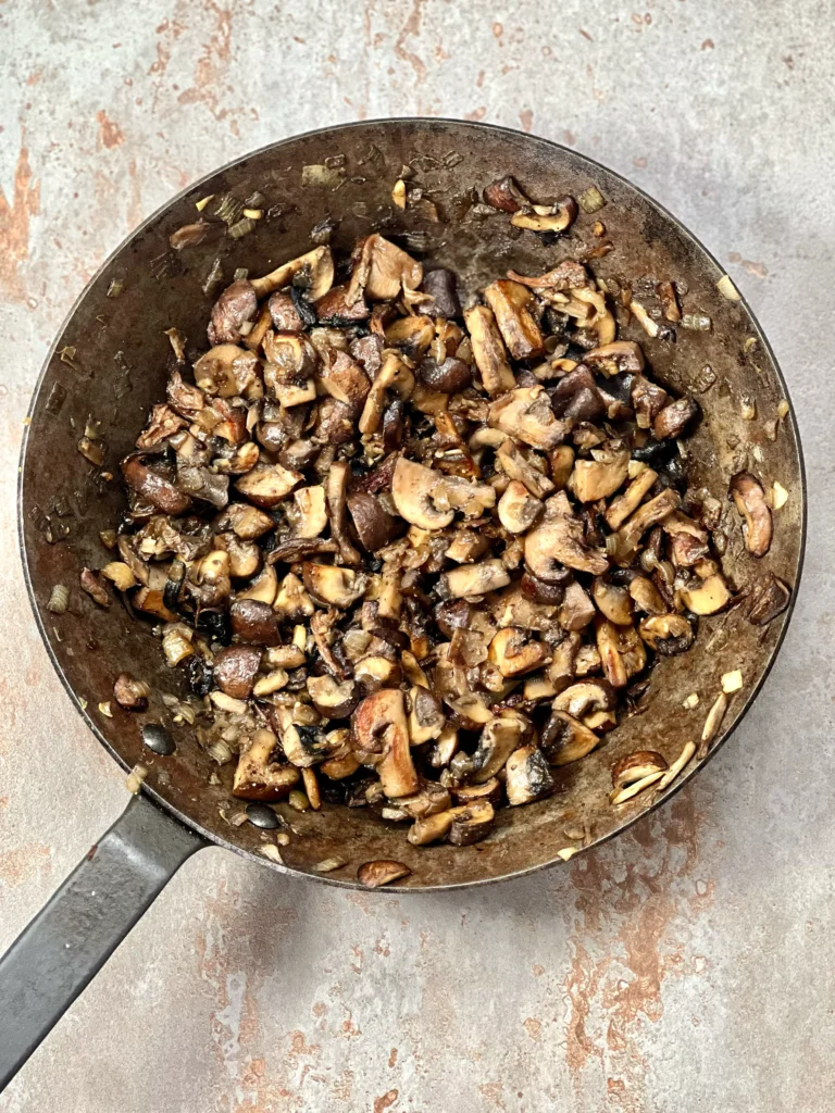 Sautéed mushrooms in a cast iron pan