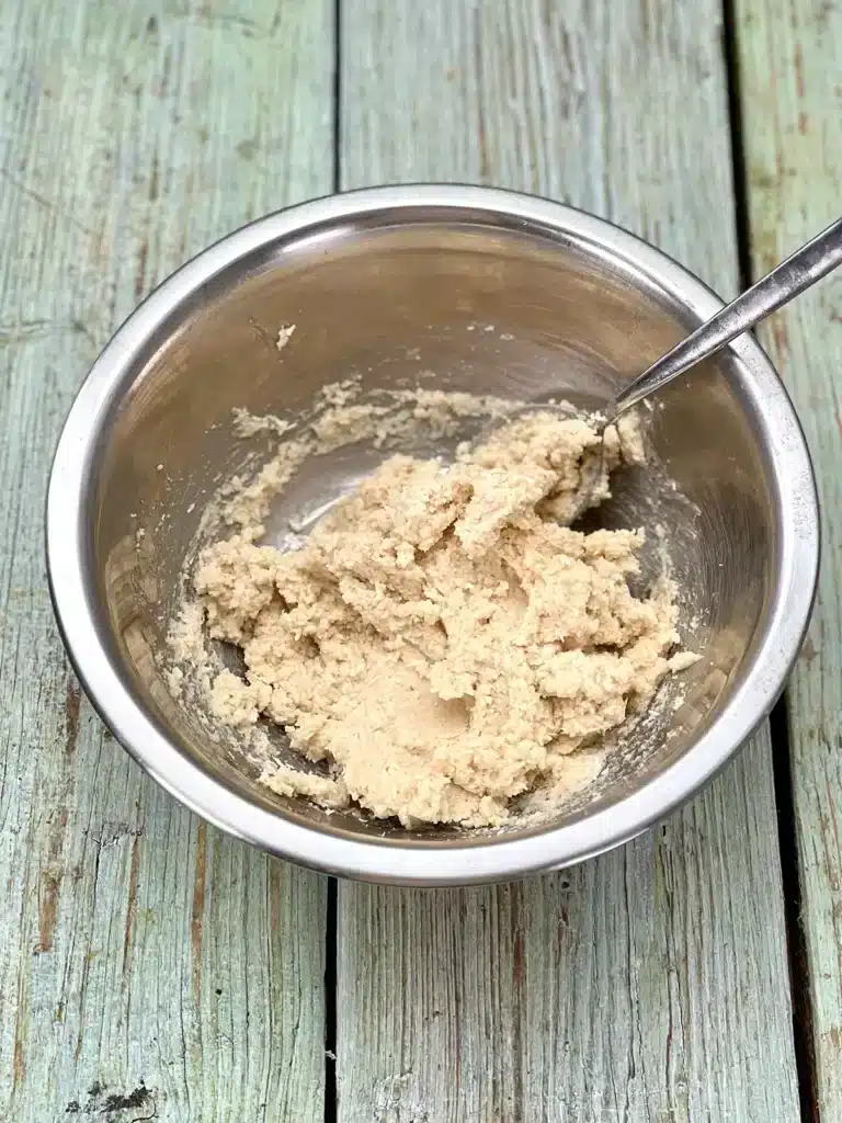 All ingredients combined in a stainless steel mixing bowl