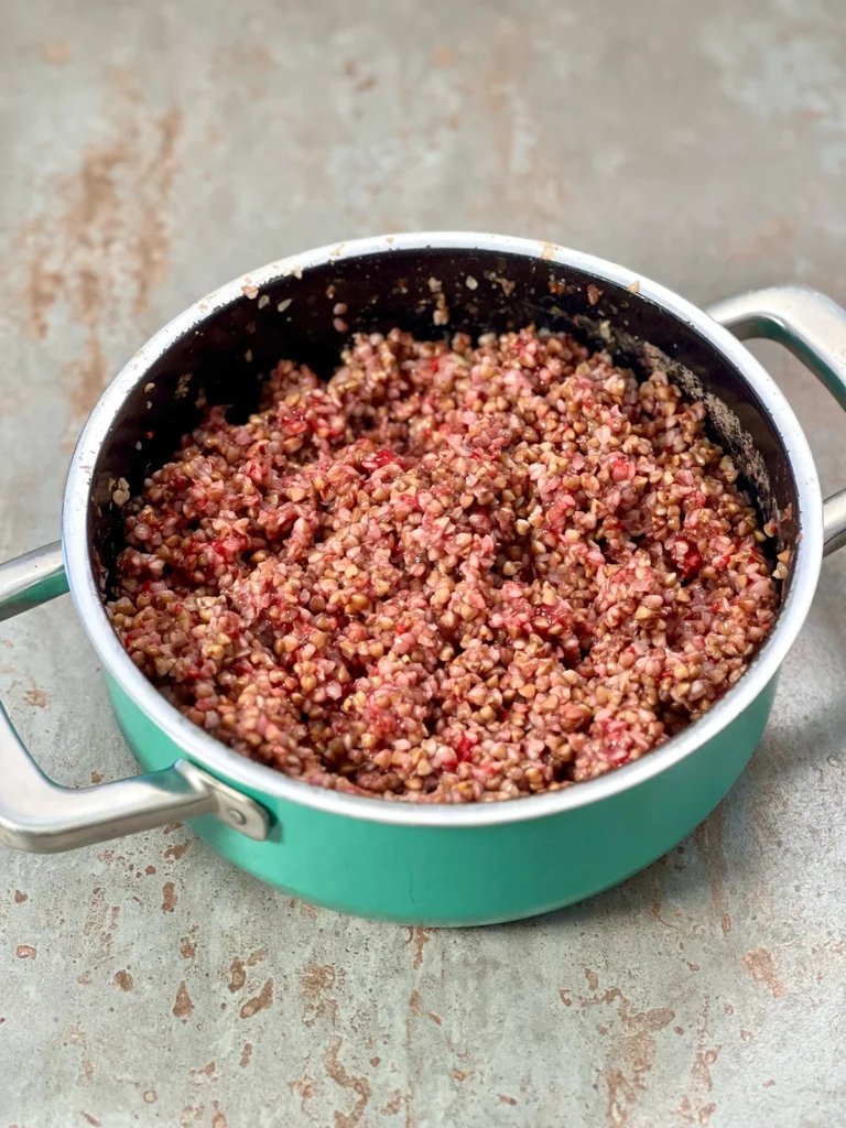 The combined ingredients in a deep turquoise pot, ready to be served