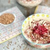 Two bowls of served buckwheat porridge, beautifully presented on a stone plate