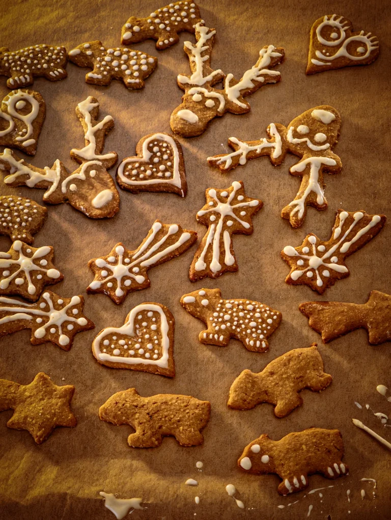 The gingerbread cookies are nearly all decorated, the icing still has to dry.