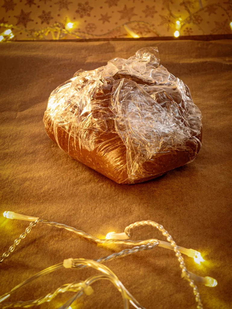 The gingerbread dough is wrapped in plastic foil to rest.