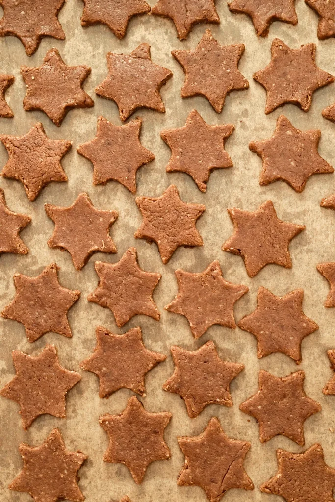 Cinnamon Star Cookies before baking on baking paper.