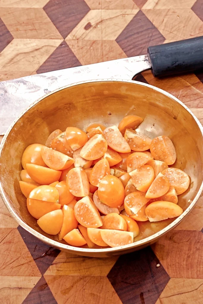 A bowl of quartered physalis.