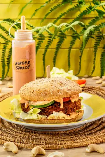 The vegan burger with vegan burger sauce with cashews is ready served.