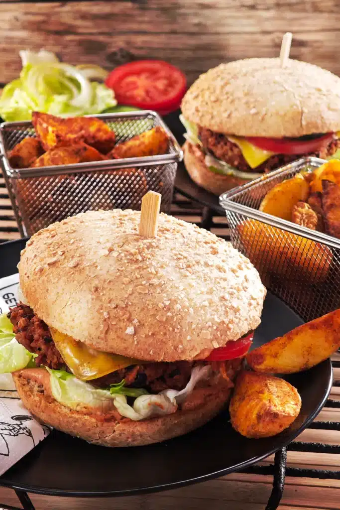 Two delicious pre-topped BBQ tempeh burgers are served.