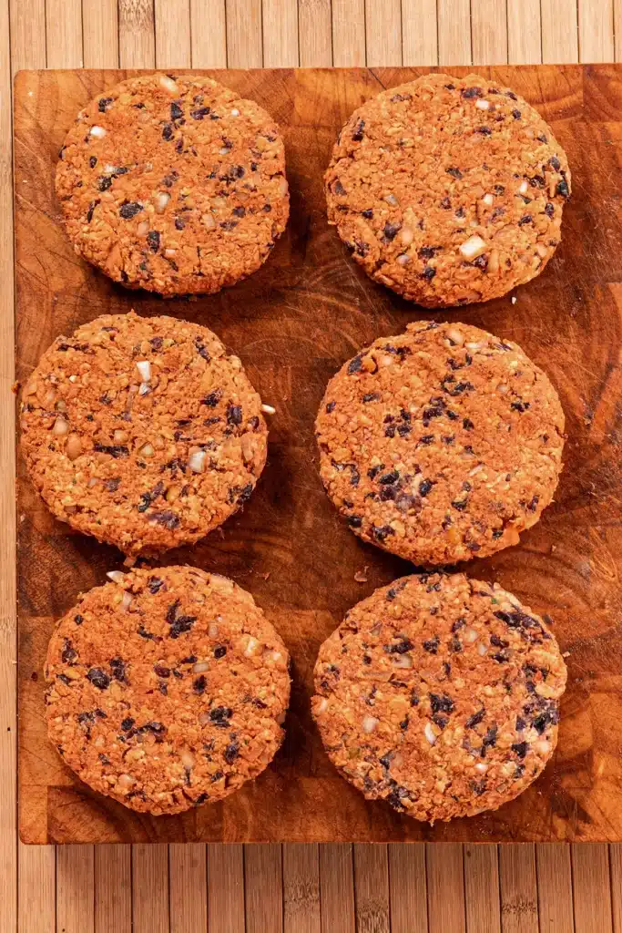 Six BBQ Tempeh Burger Patties are ready formed.