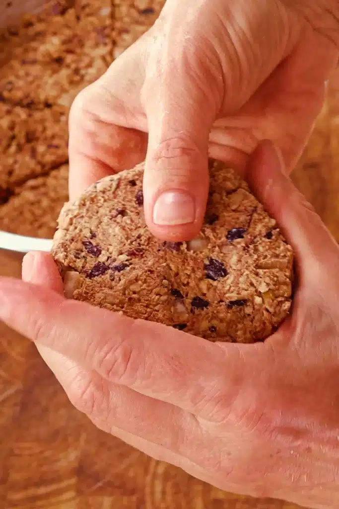 A BBQ Tempeh burger patty is formed by hand to the size of the burger bun.