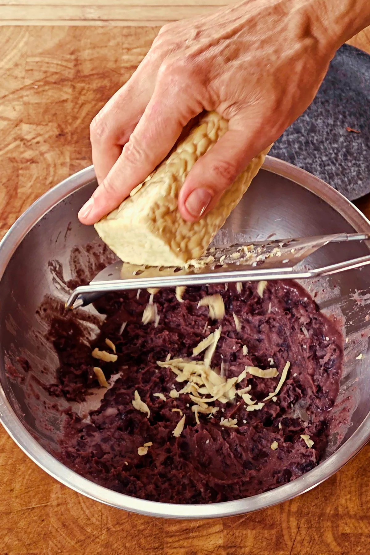 The tempeh is grated into the bean puree.